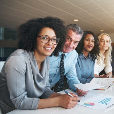 A diverse group of people in a stakeholders meeting.