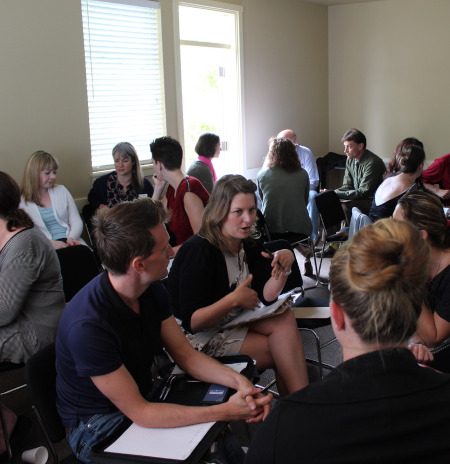 Participants having a discussion at an email marketing training session.